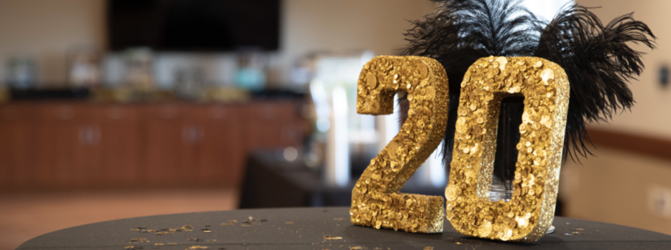gold sequin 20 number on table with black tablecloth